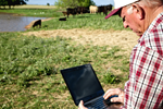 Rancher at a computer